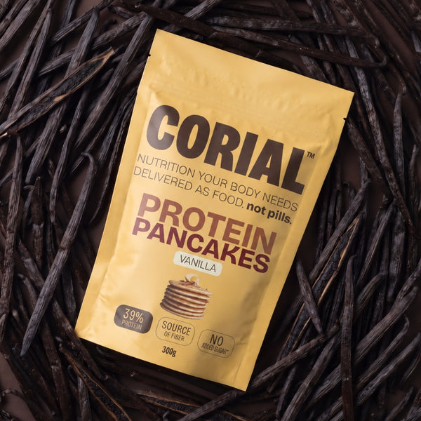Embalagem CORIAL Protein Pancakes Baunilha sobre vagens de baunilha